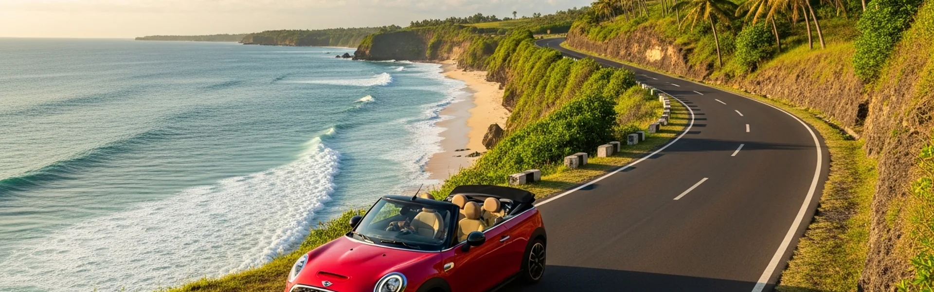 Red Mini Cooper convertible on scenic Bali coastal road