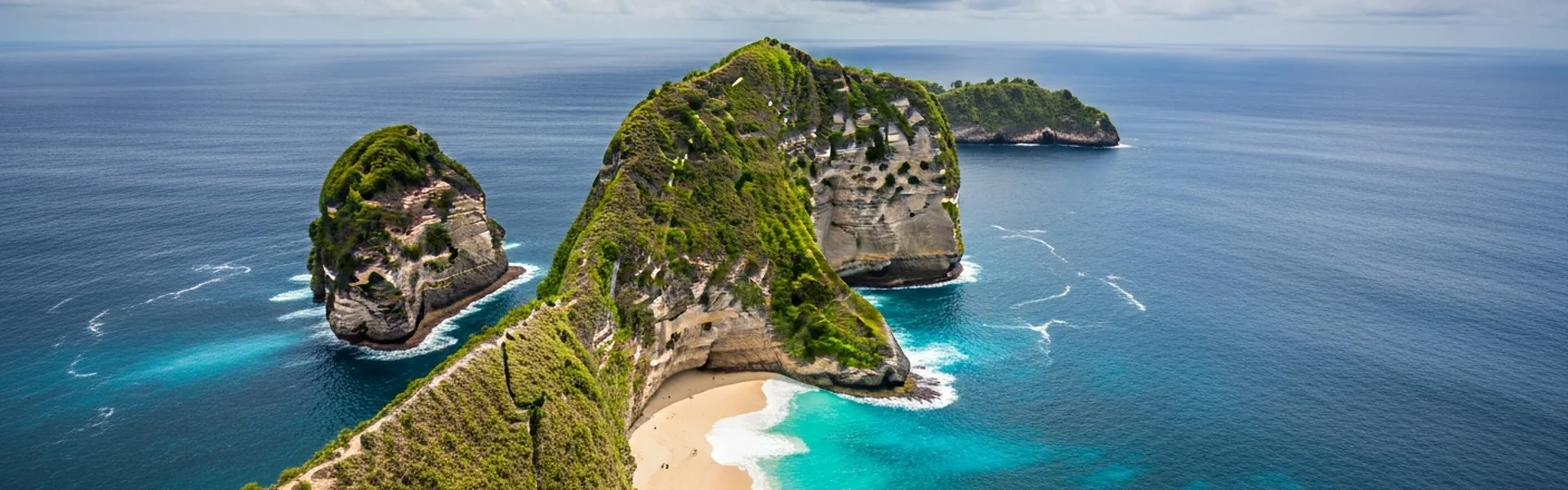 Dramatic Nusa Penida Kelingking Beach T-Rex cliff aerial view
