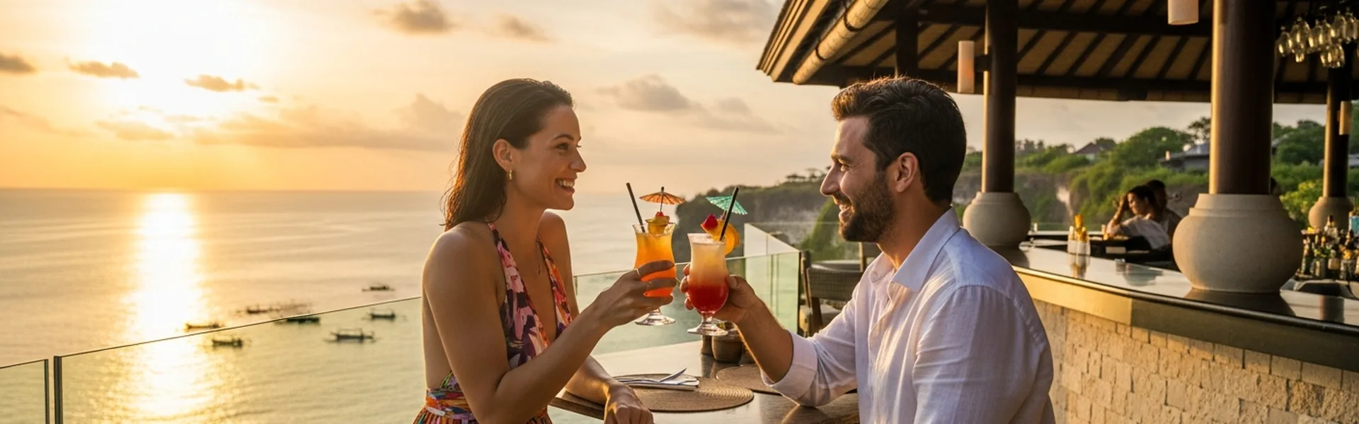 Happy luxury travelers enjoying sunset cocktails in Bali